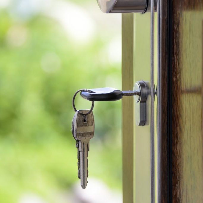 Key in lock on front door of home